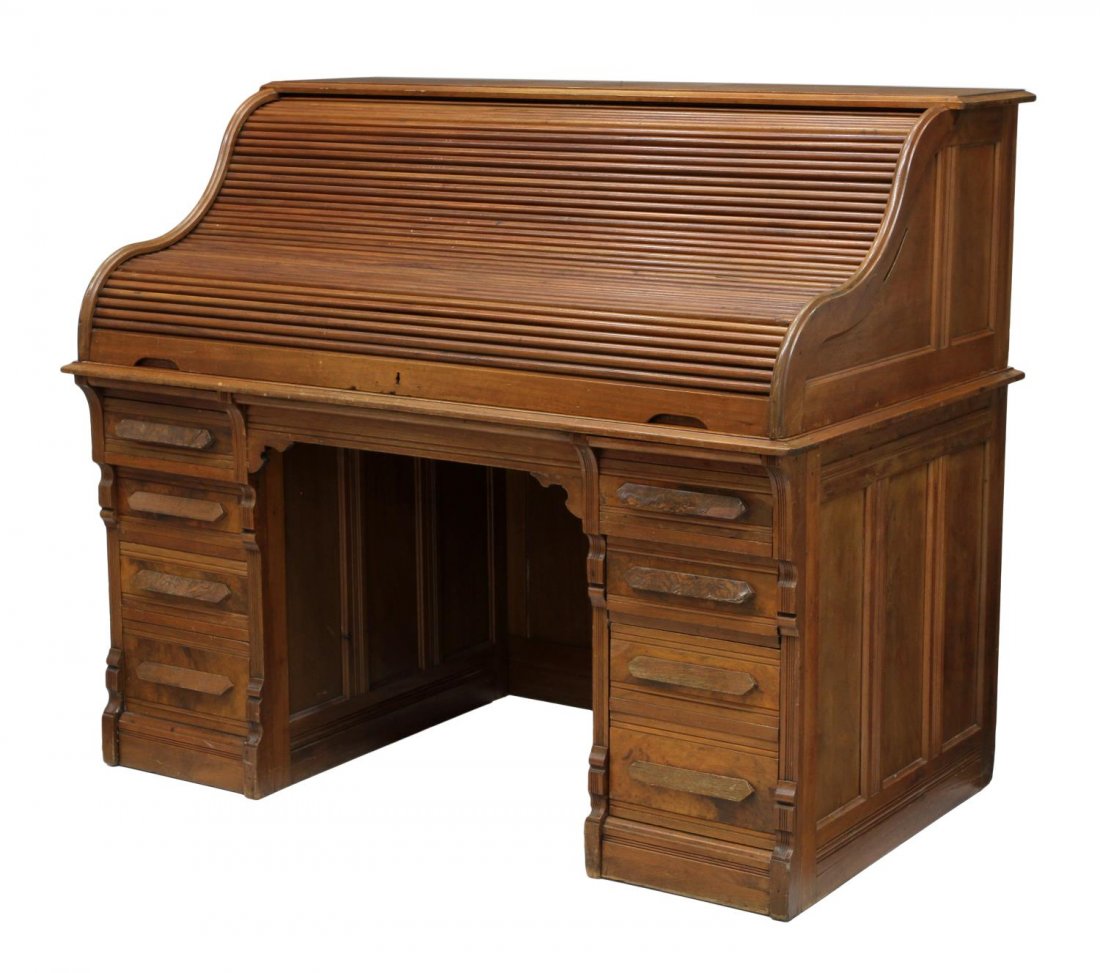 AMERICAN ROLL TOP DESK: American roll top desk, c. 1900, an 'S' roll opening to a gallery with four drawers and 21 storage slots, the desk sides and back with raised panels, 49"h, 58"w, 34.75"d Start Price: $200.00