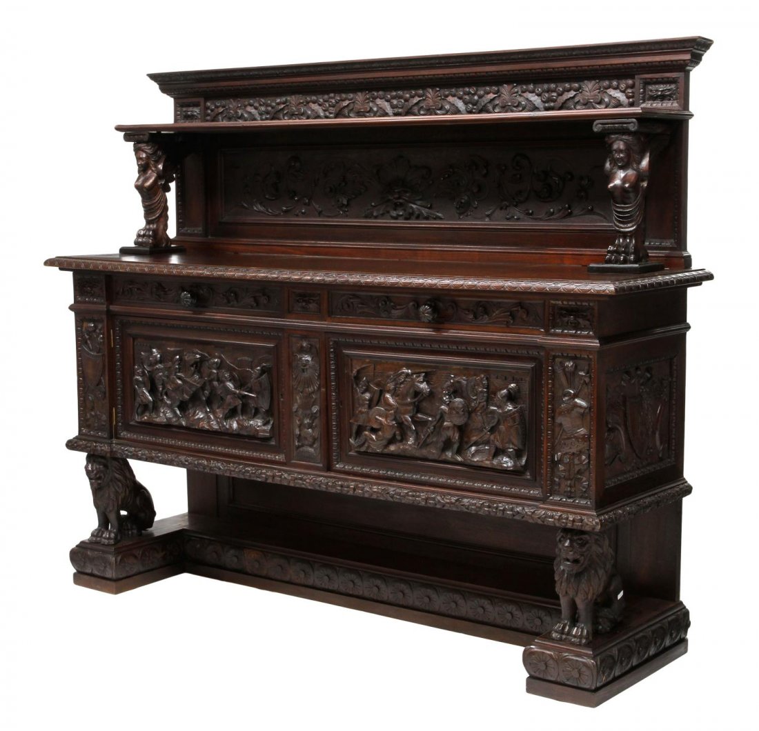 HIGHLY CARVED RENAISSANCE REVIVAL SERVER SIDEBOARD: Italian Renaissance Revival sideboard, early 20th c., the door panels, side panels having relief carved battle scenes and carved military accoutrements including spears, shields, armor, a shelf over t