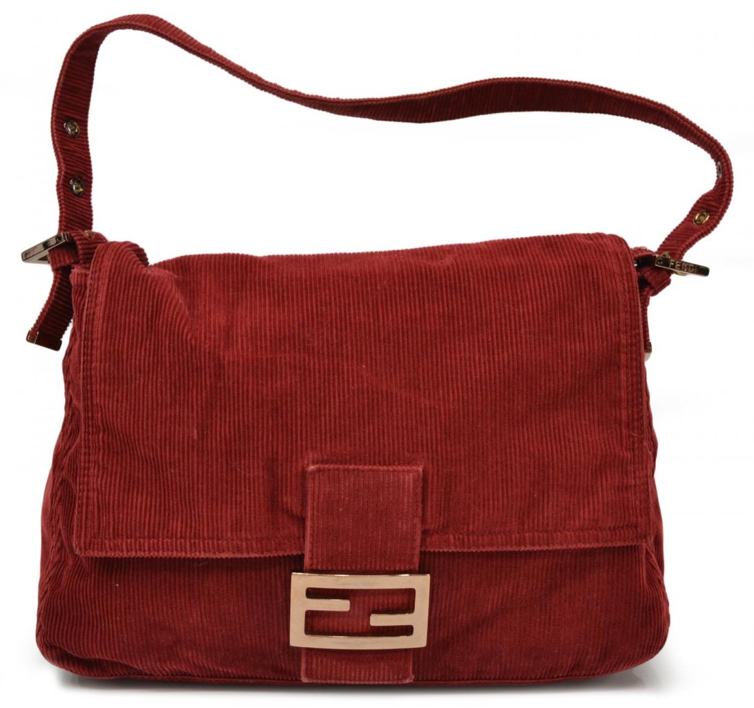 FENDI RED CORDUROY FLAP OVER SHOULDER BAG: Fendi red corduroy flap over shoulder bag, copper toned hardware, adjustable strap, lined interior with single pocket, bag: approx 7.75"h, 11.25"w, 5"d, 1lb Start Price: $75.00