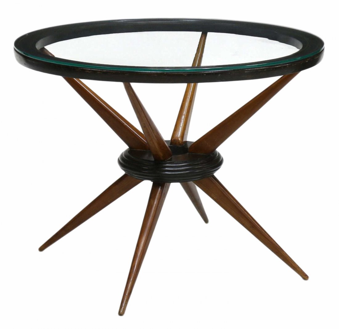 ITALIAN MID-CENTURY MODERN CIRCULAR COFFEE TABLE: Italian mid-century modern coffee table, 1950's, a circular glass top over the ebonized and natural color wood frame, rising on tapered angled legs, 21"h, 27"diameter Start Price: $150.00