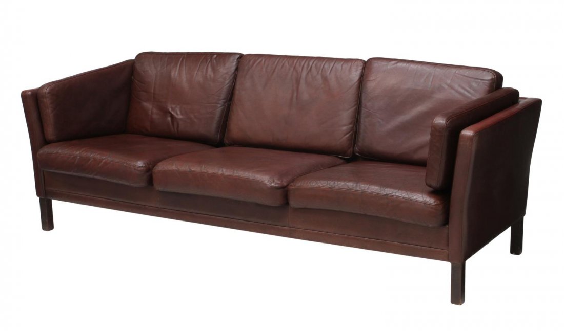 DANISH MID-CENTURY MODERN LEATHER SOFA: Danish mid-century modern brown leather sofa, 1960's, three back and three seat cushions, rising on squared legs, 30"h, 85"l, 29"d Start Price: $400.00