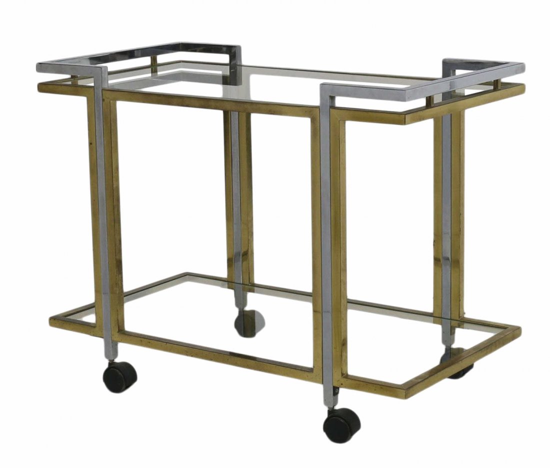 FRENCH MODERN BRASS & CHROME SERVICE CART: Brass and chrome steel two tier service cart on castors in the manner of Maison Jansen, c. 1970, 25.5"h, 33"w,, 17.75"d Start Price: $200.00