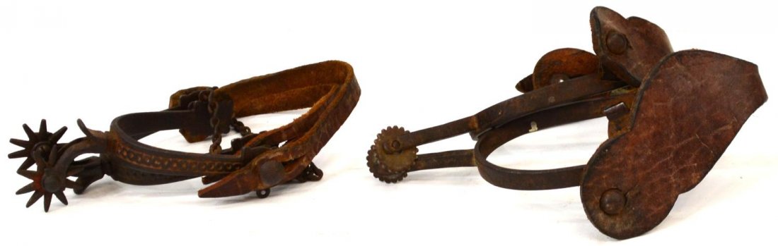 (2 PAIR) BUERMANN SPURS: ( 2 pair) Buermann spurs: (1 pair) stamped on outside shank "Pat'd" over star mark with AB" and "Hand Forged Steel", 1" rowel, inside shank: 2.75"w, 3.25"d; (1 pair) believed to be Buermann, "Pat'd" m