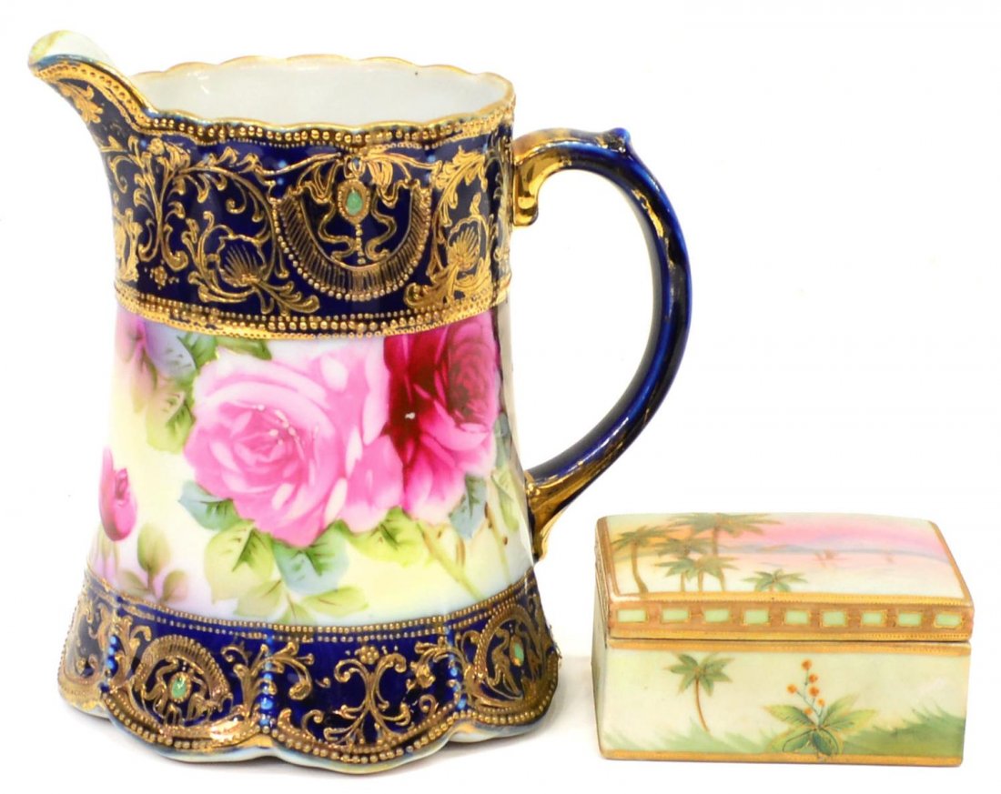(2) NIPPON GILDED COBALT ROSE PITCHER & BOX: (lot of 2) Group of Nippon porcelain: (1) parcel gilt pitcher, deep cobalt bands brightly gilded with raised enamel decor and set with jewel-like cabochons, central band of hand painted pink roses, ma