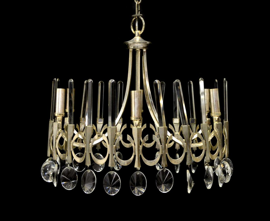 ITALIAN MID-CENTURY MODERN CHANDELIER, SCIOLARI: Italian mid-century modern chrome metal six- light chandelier, c. 1960, design by Gaetano Sciolari, silver metal ring having cut geometric design lined with six light holders and crystal bars, hung wi