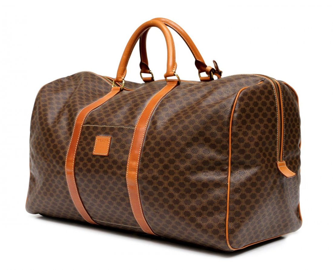 CELINE MACADAM CANVAS & LEATHER TRAVEL DUFFLE BAG: Celine Paris travel bag in brown macadam monogrammed coated canvas, tan leather handles, accents and trim, gold toned hardware, cell pocket on front exterior, zipper opening to tan lined interior with