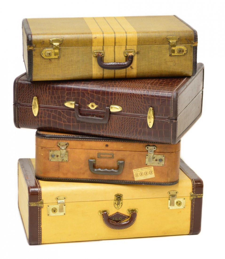 (4) VINTAGE LUGGAGE: (lot of 4) Vintage luggage shown stacked as an occasional table, (1) with Tel Aviv, Sheraton Hotel tag; (1) by Samsonite in faux alligator, largest: 9"x24"x19.5" Start Price: $40.00