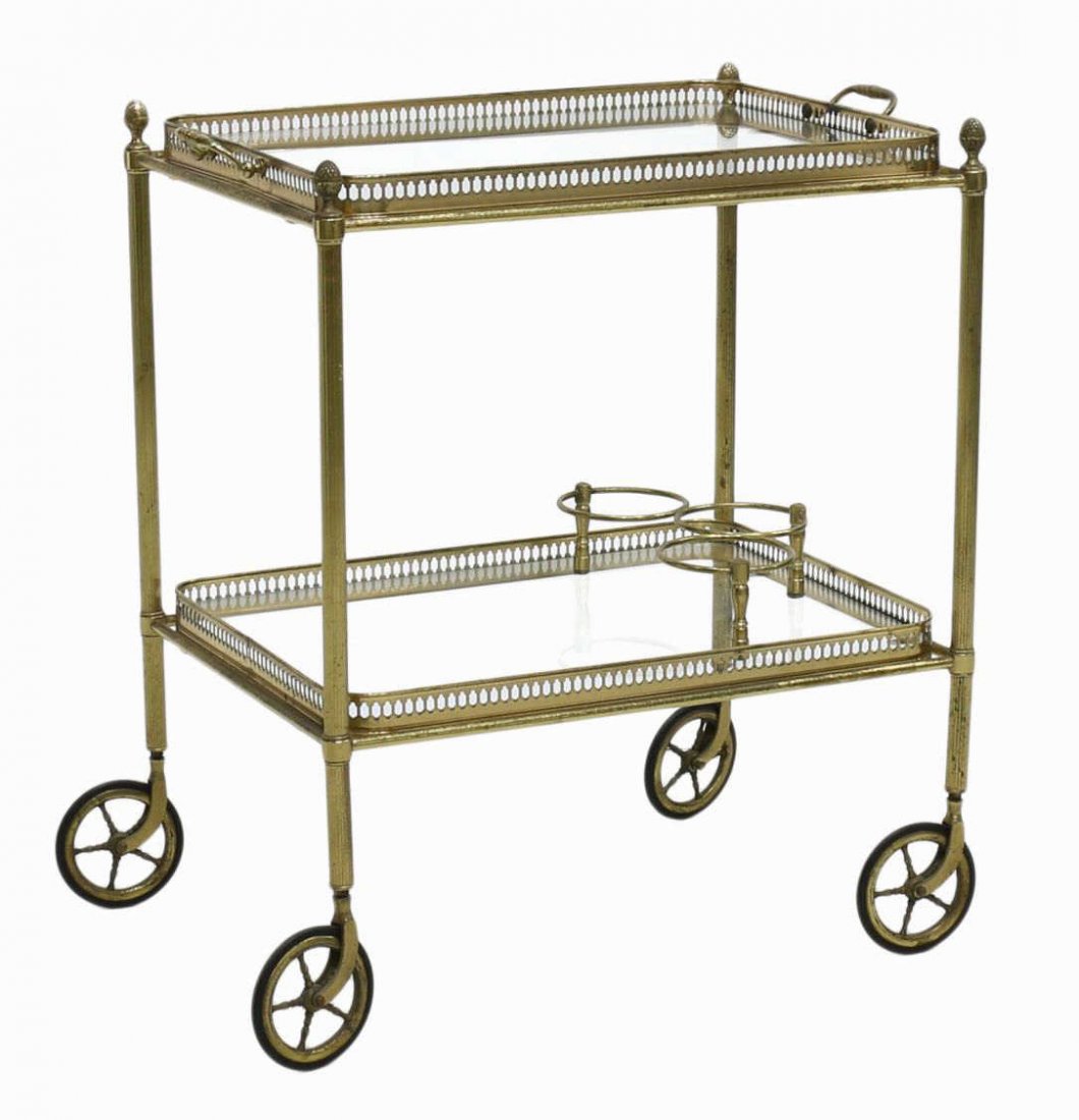 ITALIAN MODERN GLASS & BRASS TEA SERVICE CART: Italian modern glass and brass tea or service cart, 1960's, rectangular, the upper tray removable, a lower glass tier, raised on spoked wheels, 25.75"h, 15.5"w, 23"d Start Price: $80.00