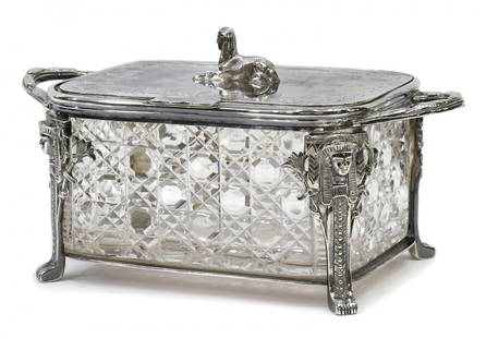 EGYPTIAN REVIVAL CUT GLASS & SILVERPLATE BOX: Egyptian Revival cut glass and silver plate biscuit jar, John Round & Son, Sheffield, c. 1870's / 80's, a recumbent sphinx surmounting the engraved hinged lid, four figural uprights on each corner of