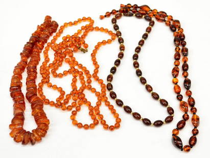 (4) LADIES VARIOUS AMBER BEADED NECKLACES: (lot of 4) Ladies amber necklaces, various tones of amber chips and beads, (1) free form chunks and chips, 21"l, (1) oval beads with gilt metal spacers, 22.75"l, (1) long strand of round beads,