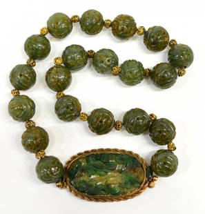 CHINESE BEADED JADE & 14KT TRIM NECKLACE: Ladies Chinese beaded jade necklace, pierced and carved jade beads joined by a floral carved jade pendant / plaque, 14kt gold rope trim and clasp, 16"l, 81.6 grams (inclusive of all materials) Start