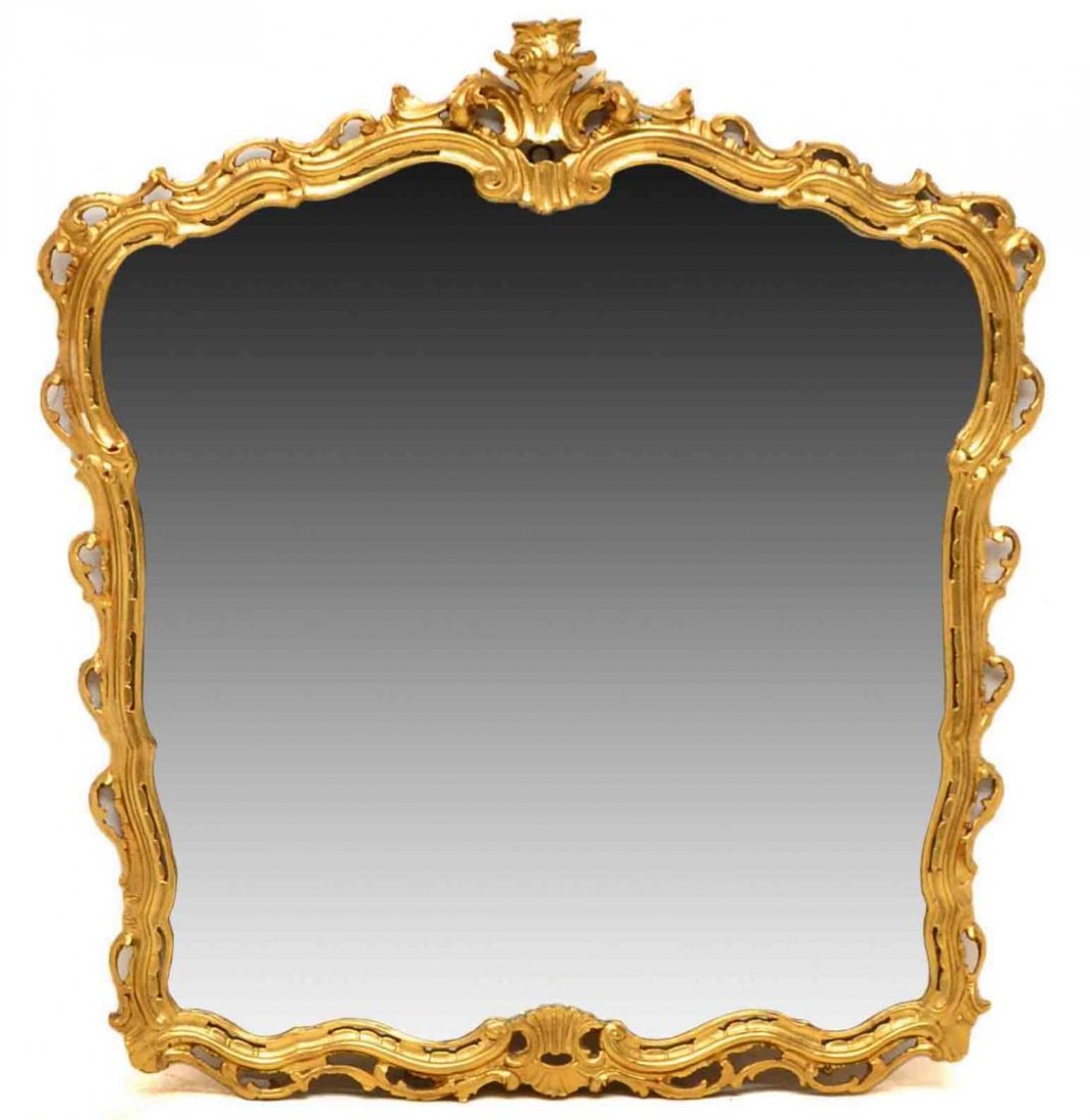 LOUIS XV STYLE GILTWOOD FRAMED MIRROR: Louis XV style giltwood mirror, early 20th c., having a foliate carved pierced frame with protruding acanthus cornice, chip on foliage, 48.5"h, 44"w Start Price: $100.00