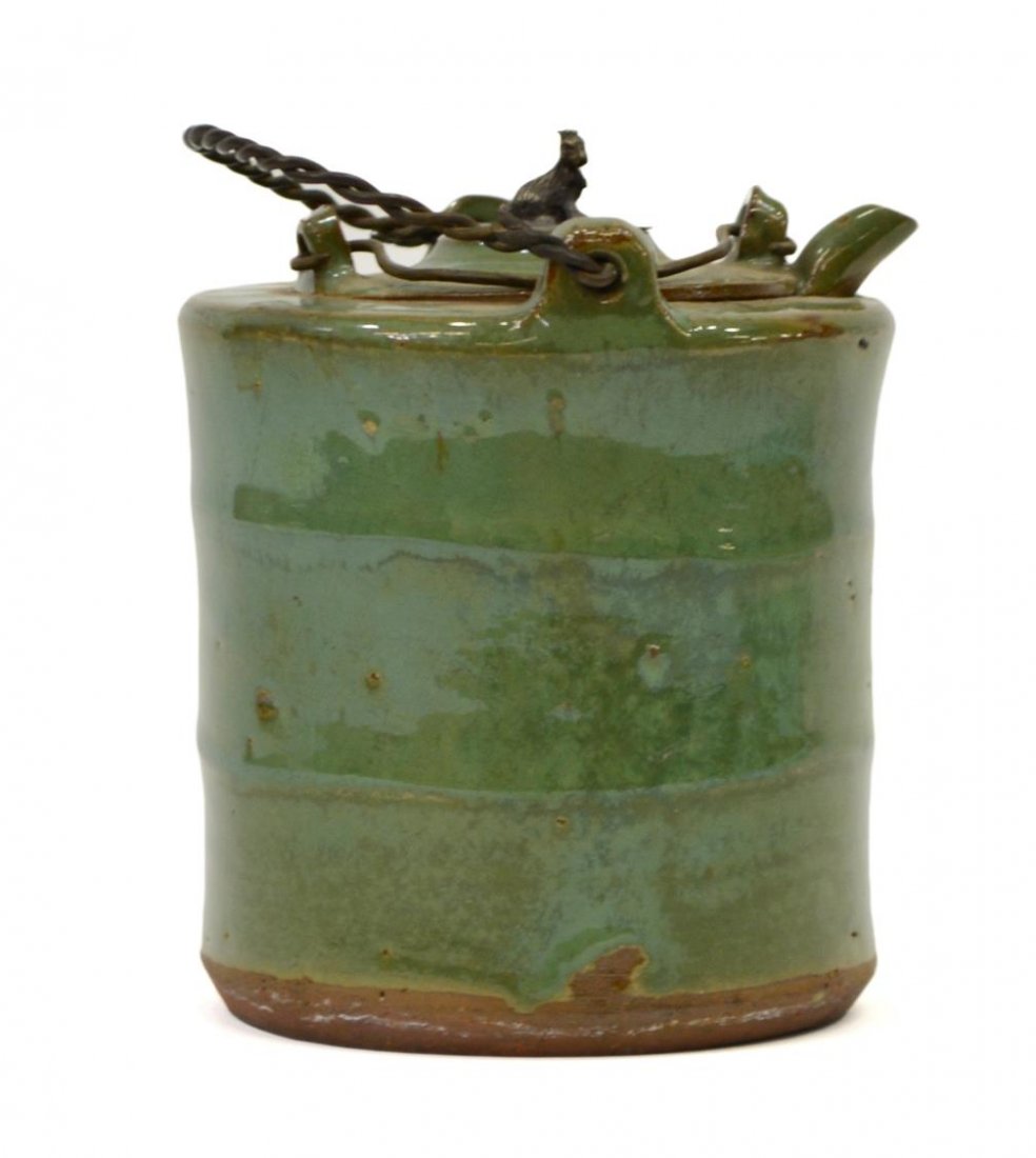 CHINESE LONGQUAN CELADON EARTHENWARE TEAPOT: Longquan celadon earthenware teapot, China, Ming dynasty, a small finial in the form of a seated animal on the metal plug, fitted into the circular central pot with spout and metal handle, twisted wir