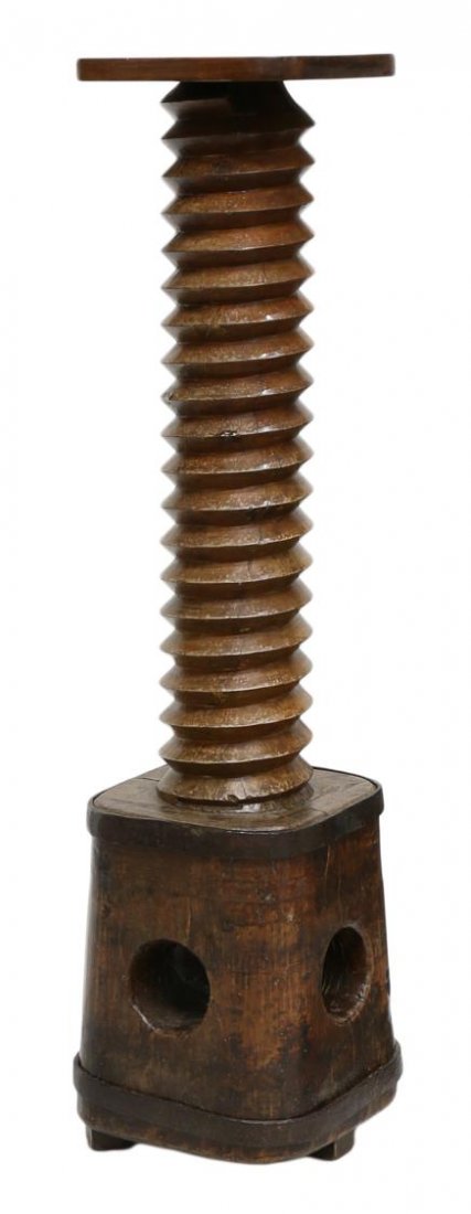 ANTIQUE FRENCH GRAPE WINE PRESS: French carved wood pedestal fashioned from an antique wine press, 19th c., the later square pedestal top rising from a screw-form stem with a large block base, 51.25"h, 11.75"w, 11.75"d Start Price: $