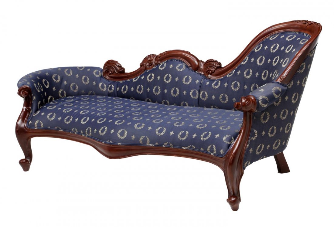 CARVED MAHOGANY MERIDIENNE: Carved mahogany meridienne, late 20th c., the serpentine foliate frame upholstered in blue fabric with wreath accents, rising on scroll foot cabriole legs, 34.75"h, 78"l, 29"d Start Price: $150.00