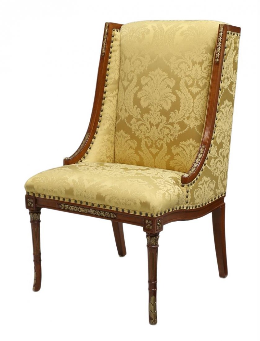 HENREDON FRENCH STYLE PARCEL GILT MAHOGANY CHAIR: French Directoire style parcel gilt mahogany armchair upholstered in gold on gold foliate pattern fabric, Henredon, 20th c., the back with sloping vertical sides over the seat raised on ribbed and tur