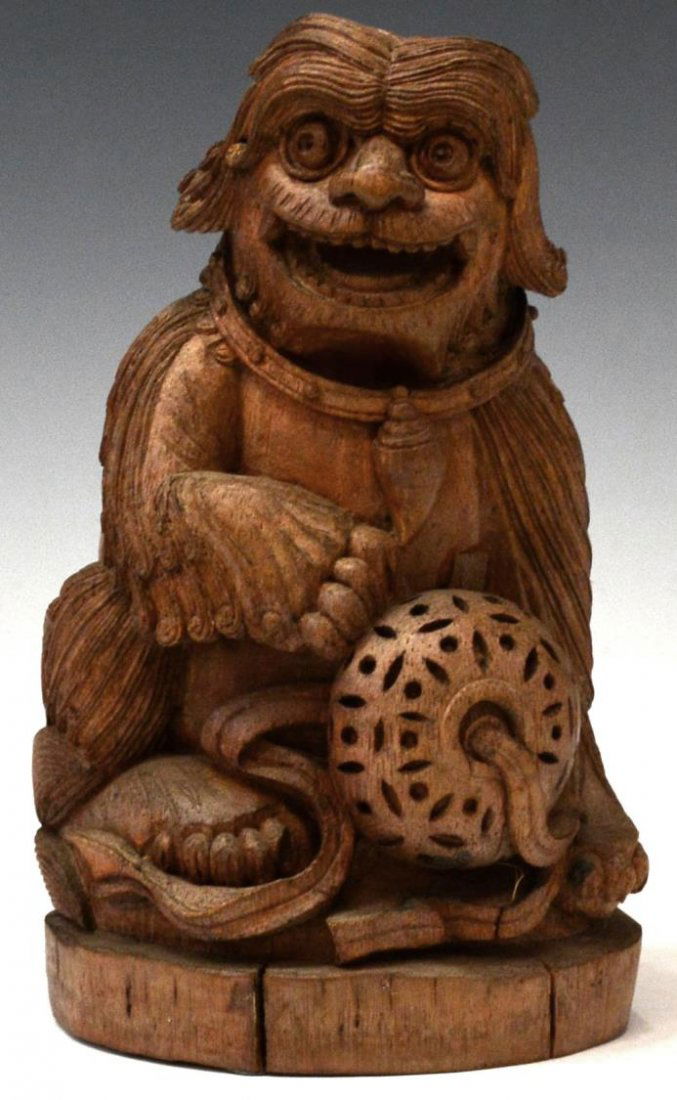 ANTIQUE CHINESE CARVED BAMBOO FOO LION FIGURE: Chinese carved bamboo model of foo lion, late 19th c., the seated figure with curled mane, paw on a pierced decoration, 7.75"h, .25lb Start Price: $150.00