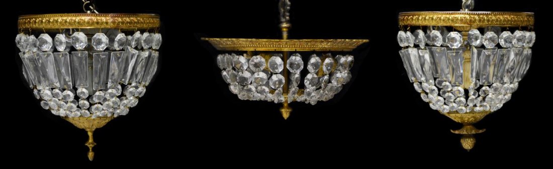 (3) EMPIRE STYLE CRYSTAL CEILING MOUNT CHANDELIERS: (lot of 3) Empire style crystal ceiling mount chandeliers, 20th c., gilt metal ring having foliate decor housing lights hung with crystal prisms forming a dropped dome, in need of wiring, largest: 11"
