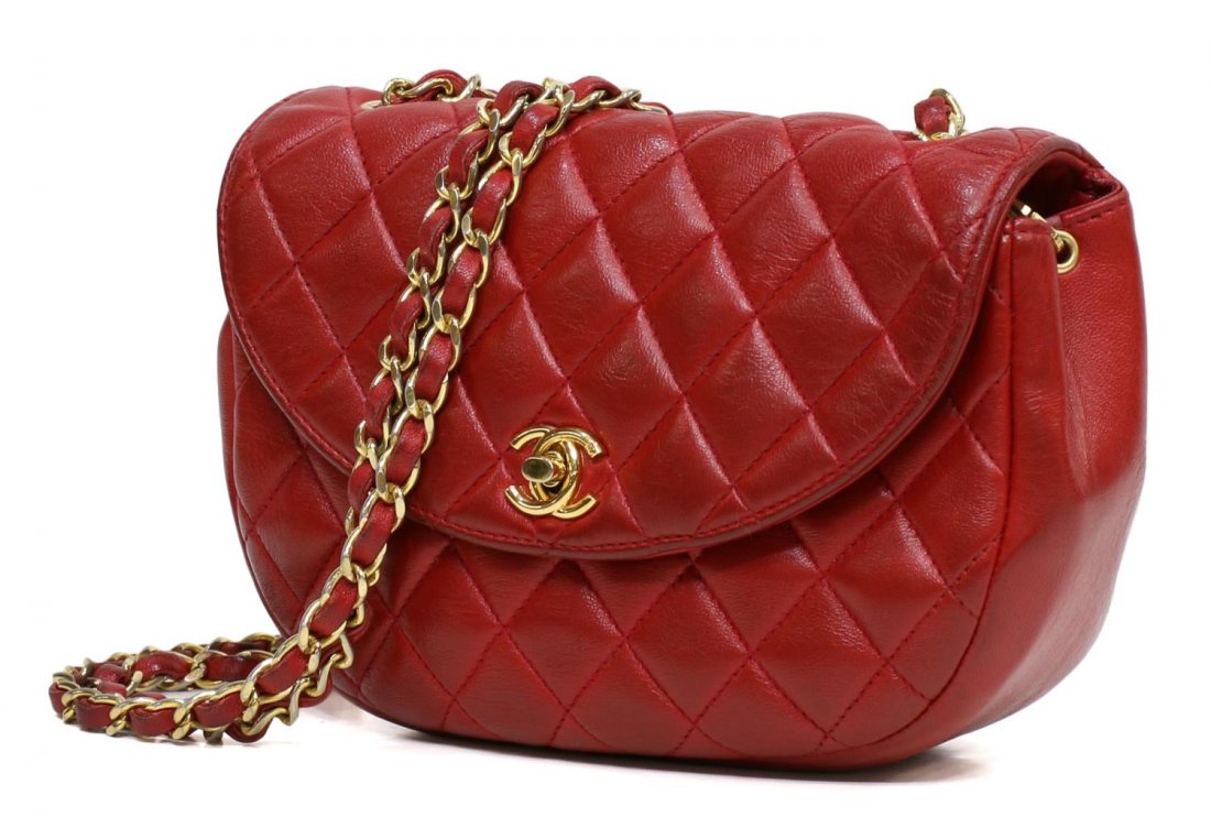VINTAGE CHANEL RED QUILTED LEATHER SHOULDER BAG: Chanel red quilted leather Half-Moon Flap shoulder bag with gold plated hardware, interlocking CC logo twist-lock opening to red leather logo lined interior and designer gold-stamped name on interior