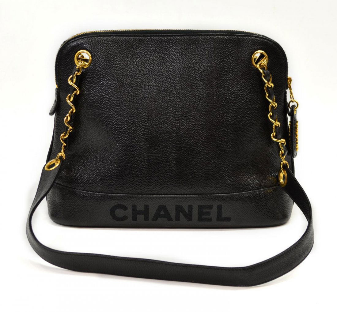 CHANEL BLACK QUILTED CAVIAR LEATHER SHOULDER BAG: Chanel black quilted caviar leather zip-top shoulder bag with stitched CHANEL, black fabric interior with two side zipper pockets, single zipper closure, double partial gold chain straps with interwov