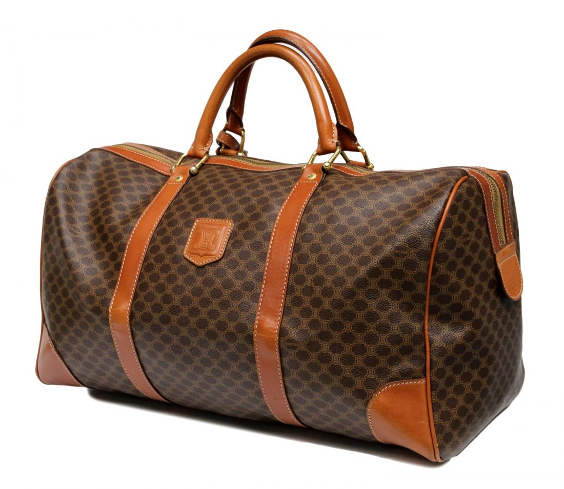 CELINE BROWN MACADAM MONOGRAM CANVAS HANDBAG: Celine Paris travel bag in brown macadam monogrammed canvas, brown leather handles and trim, gold tone hardware, single zip opening to large brown lined interior with single zip pocket, accompanied by