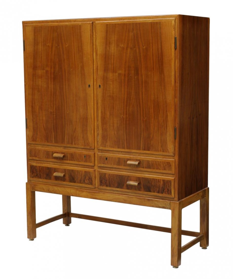 DANISH TEAKWOOD MODERN TALL CABINET: Danish modern teakwood cabinet, two doors opening to the birch lined shelved interior, four lower short drawers, rising on stretcher joined squared legs, 51.75"h, 39.5"w, 17"d *Provenance: Estate of W