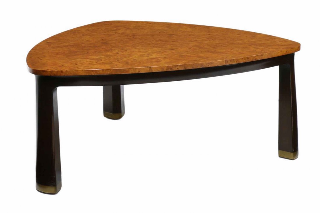 WORMLEY DUNBAR ELMWOOD COFFEE TABLE, #6029: Dunbar coffee table, Model 6029, design by Edward Wormley (American, 1907-1995), shaped triangular burled elmwood top raised on three black supports with brass capped feet, Dunbar 'D' tag and shipping