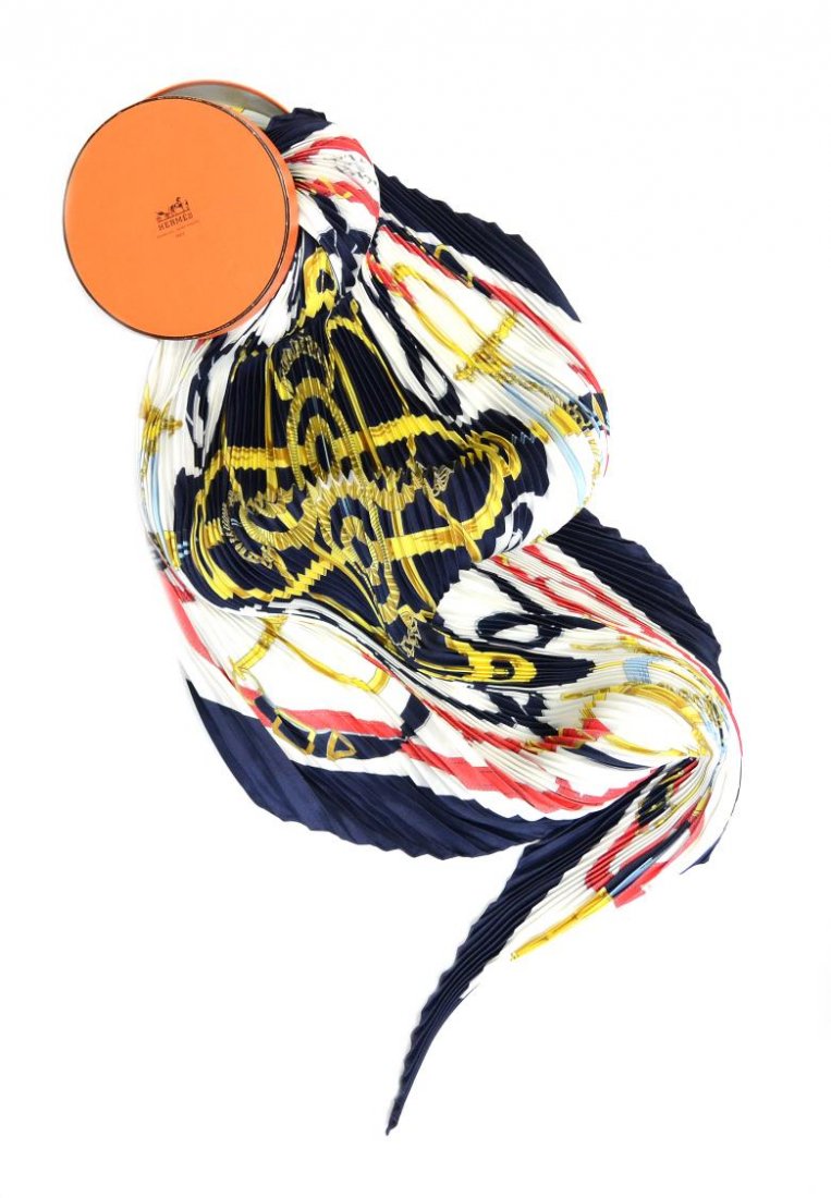 HERMES EPERON D'OR CARRE PLISSE SILK SCARF: Hermes 'Eperon d'Or' carre plisse scarf in navy and white silk, design first issued 1974 by Henri d'Origny, depicting equestrian's gear, tag partially attached, accompanied by original box, approx 55"