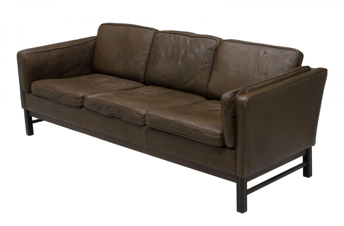 DANISH MID-CENTURY MODERN BROWN LEATHER SOFA: Danish mid-century modern brown leather sofa, upholstered frame around the three seat sofa, removable side, back and seat cushions, rising on squared legs, approx 26"h, 78"w, 34.5"d Start Price: $400.