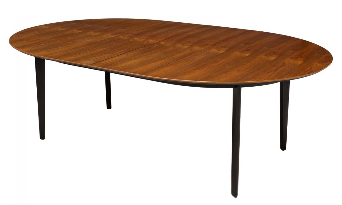 WORMLEY DUNBAR EXTENSION TABLE & LEAVES, #696: Dunbar extension table, Model 696, design by Edward Wormley (American, 1907-1995), an oval walnut top with two skirted leaves opening to 88"l, rising on ebonized tapered legs, Dunbar green tag at unde