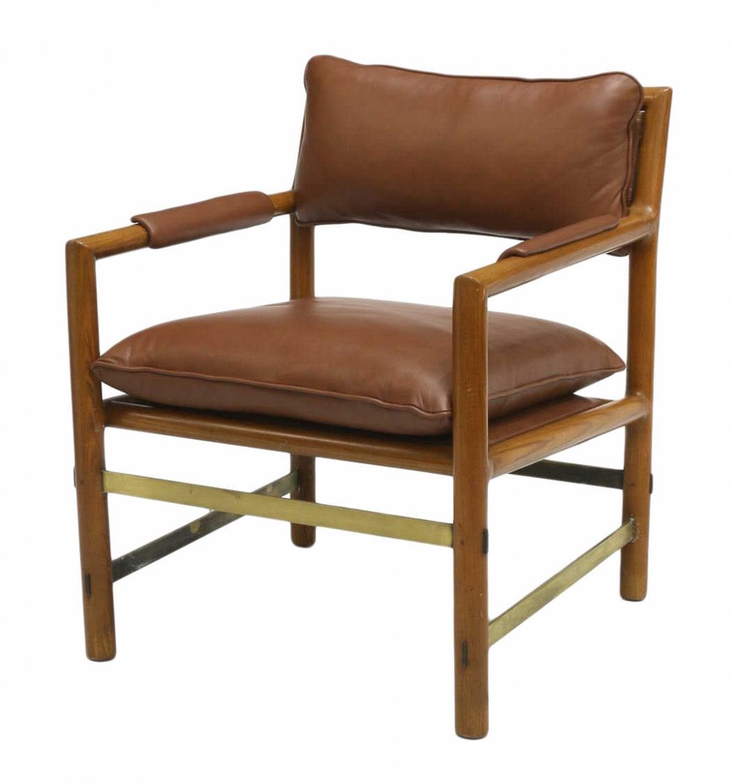 WORMLEY DUNBAR LEATHER & BRASS ARM CHAIR: Dunbar arm chair, design by Edward Wormley (American, 1907-1995), slanted brown leather cushioned back with turned padded arms, a brown leather cushioned seat, four brass finish stretchers mortised to