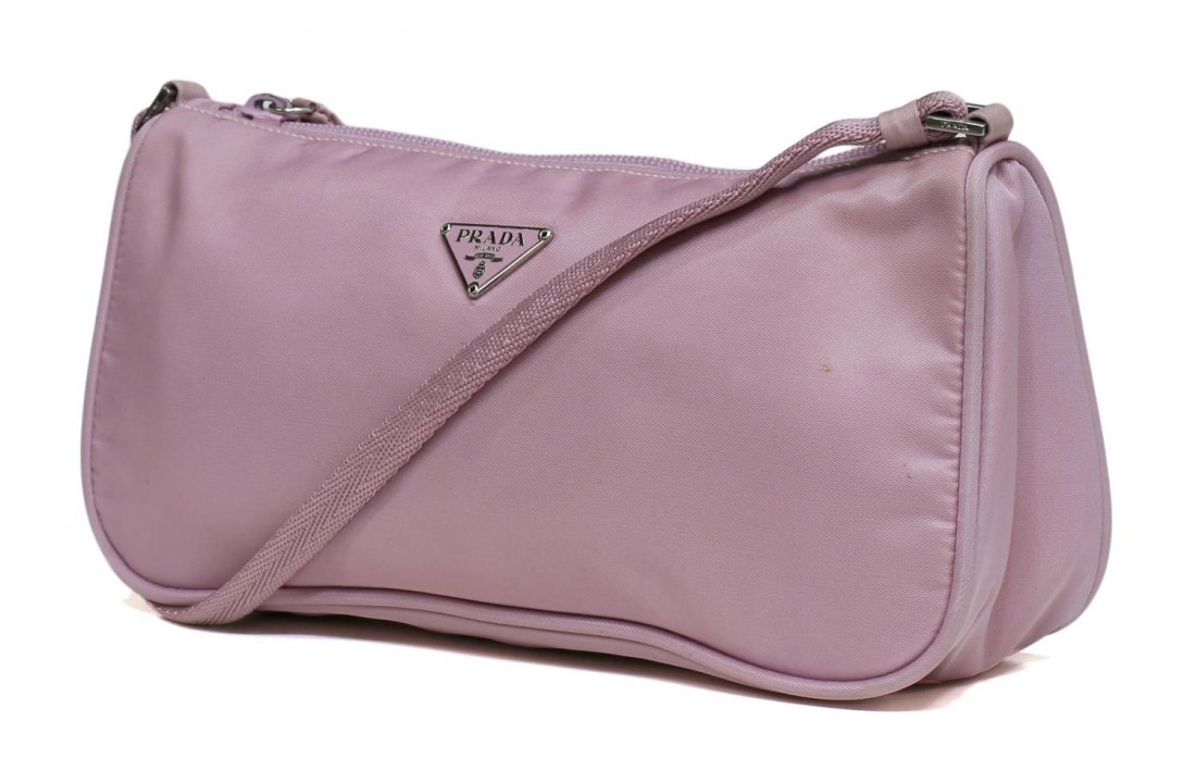 PRADA LAVENDER/PINK NYLON ACCESORIES POUCH: Prada accessories pouch in lavender-pink nylon, silver tone hardware, triangle plate logo on front, zip opening to nylon lined interior, non-adjustable strap, approx 4.75"h, 9.5"w, .25lbs total Start
