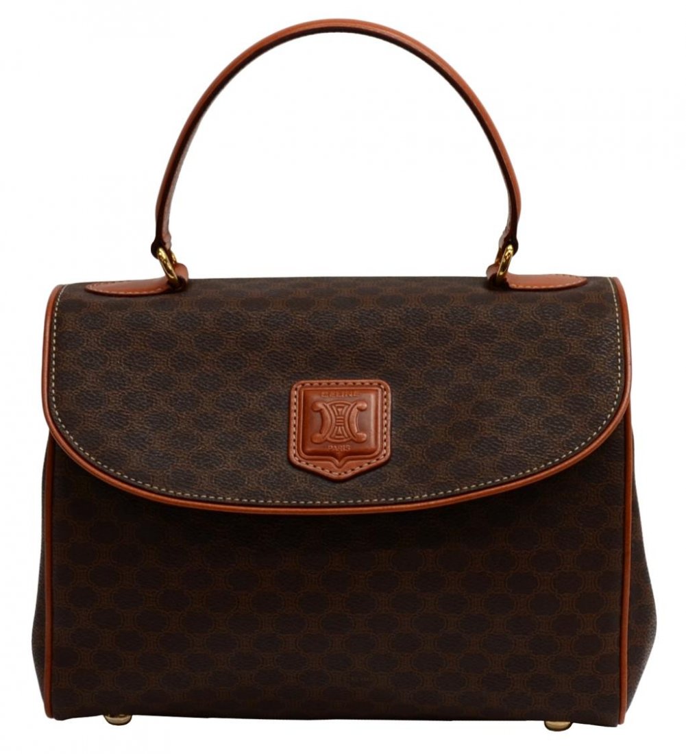 CELINE BROWN MACADAM MONGRAM CANVAS HANDBAG: Celine Paris handbag in brown macadam monogrammed canvas, brown handle and trim, gold toned hardware, magnetic snap opening to brown lined interior with single zip pocket and large cell pocket, bag: a