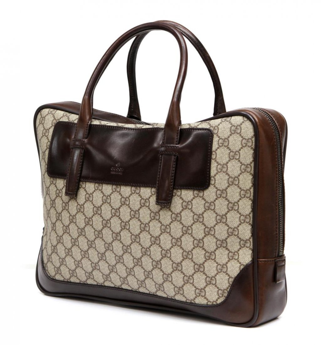 LARGE GUCCI MONOGRAM CANVAS & LEATHER HANDBAG: Gucci handbag in brown monogram coated canvas with brown leather handles, brown interior with one side zipper pocket and open compartment with pen holder and card slot, accompanied by dust bag, bag: a
