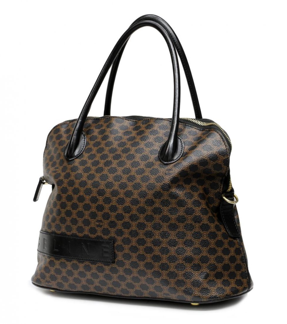 CELINE BOLIDE FORM MACADAM MONOGRAM HANDBAG: Celine bolide shaped handbag in black / brown macadam monogram canvas, black trim and handles, gold toned hardware, single zipper opening to black lined interior with single zip side pocket, accompani