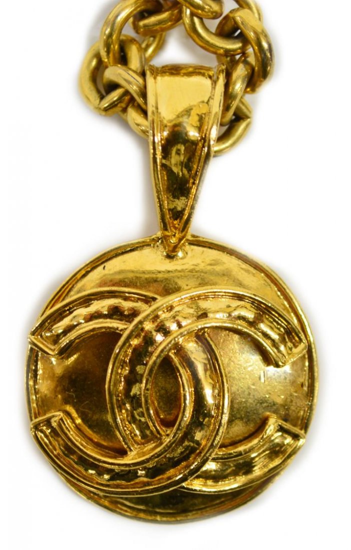 VINTAGE CHANEL GOLD TONE CC CHAIN NECKLACE: Vintage Chanel gold tone long chain necklace with round interlocking CC logo pendant, Spring 1994 Collection, plaque on back of pendant marked Made in France with a 94 and P flanking the logo, approx