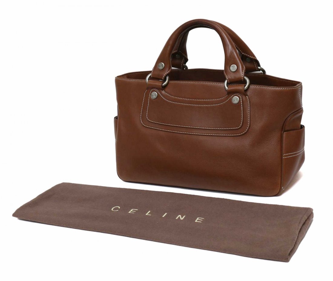 CELINE CARAMEL LEATHER BOOGIE BAG PURSE: Celine Paris 'Boogie Bag' handbag / satchel in caramel leather, silver toned hardware, opening to divided fabric lined interior with a single full length zip pocket between two open main slip pockets,
