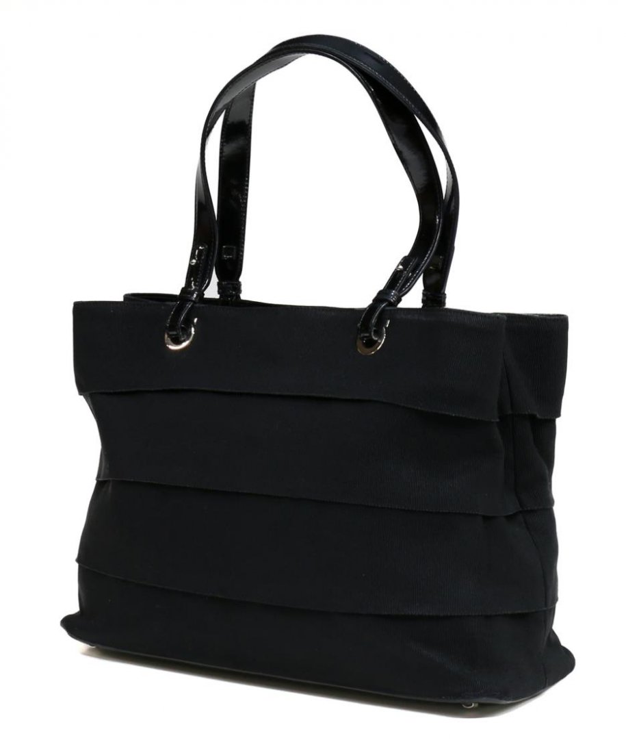 SALVATORE FERRAGAMO BLACK CANVAS SHOULDER BAG: Salvatore Ferragamo shoulder bag in black canvas with patent leather handles, black fabric interior with three compartments, central compartment with zipper closure, single flap with magnetic snap clo