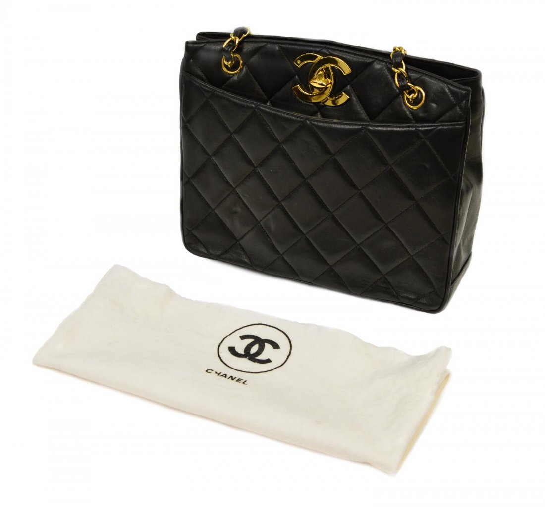 CHANEL QUILTED BLACK LEATHER SHOULDER BAG: Chanel shoulder bag in quilted black leather and gold tone hardware, black leather interior with two side zipper pockets, CC logo turn lock closure, double gold chain straps with interwoven leather, a