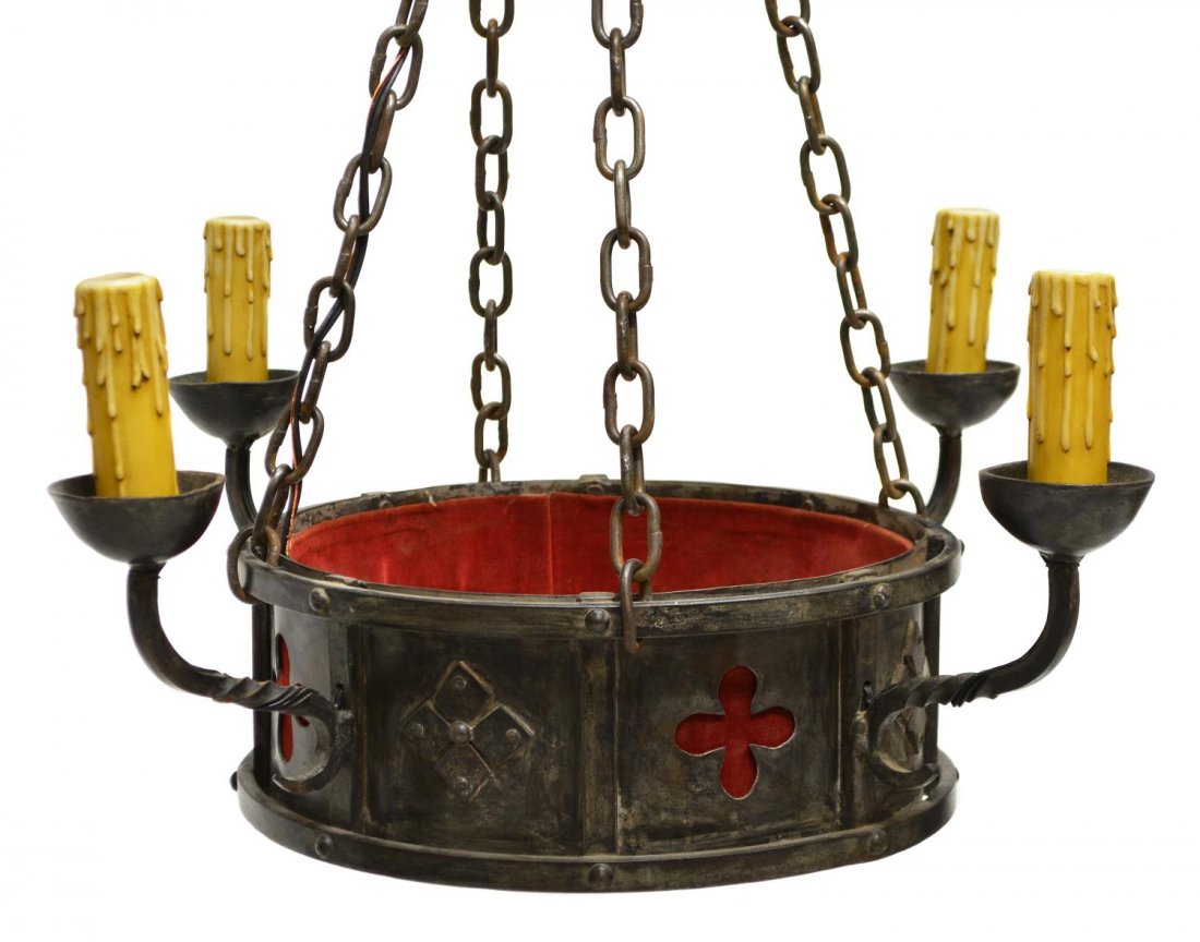 GOTHIC STYLE WROUGHT IRON HANGING CHANDELIER: Gothic style iron four-light chandelier, circular corona cast with four quatrefoil apertures, interior lined in red fabric, issuing spiraled arms terminating in nozzles with faux candlesticks, four ch