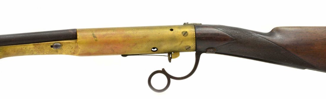 ANTIQUE AMERICAN BUGELSPANNER TYPE AIR RIFLE: "Bugelspanner" type air rifle, c. 1900, no makers name, estimated at .20-.25 caliber, tip up 24" round barrel, scrolled engraving on metal parts including worn engraving of America eagle with spears, 
