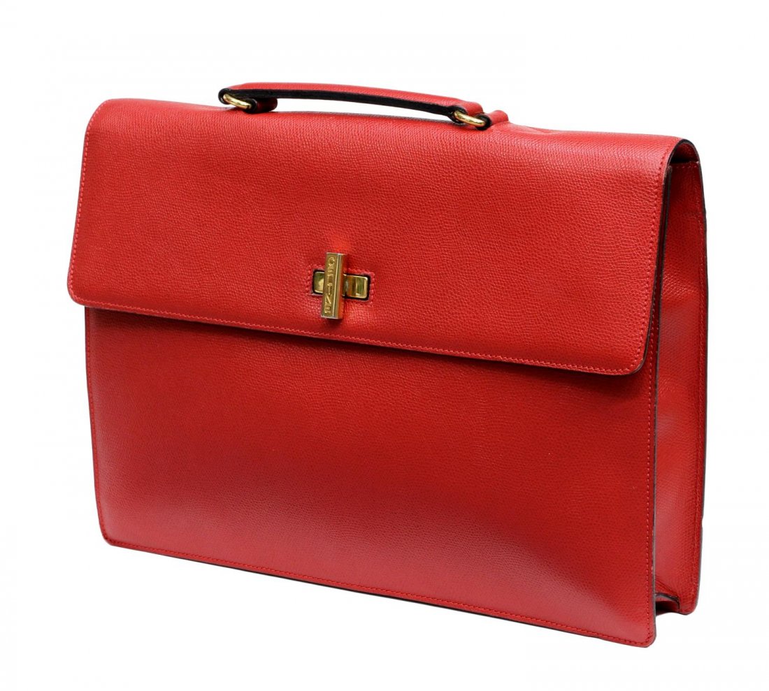 CELINE GRAINED LEATHER BRIEFCASE: Ladies Celine grained leather briefcase / laptop bag in red, gold toned hardware, turnlock clasp and flap opening to red lined interior with single zip pocket and two cell pockets, exterior back has f