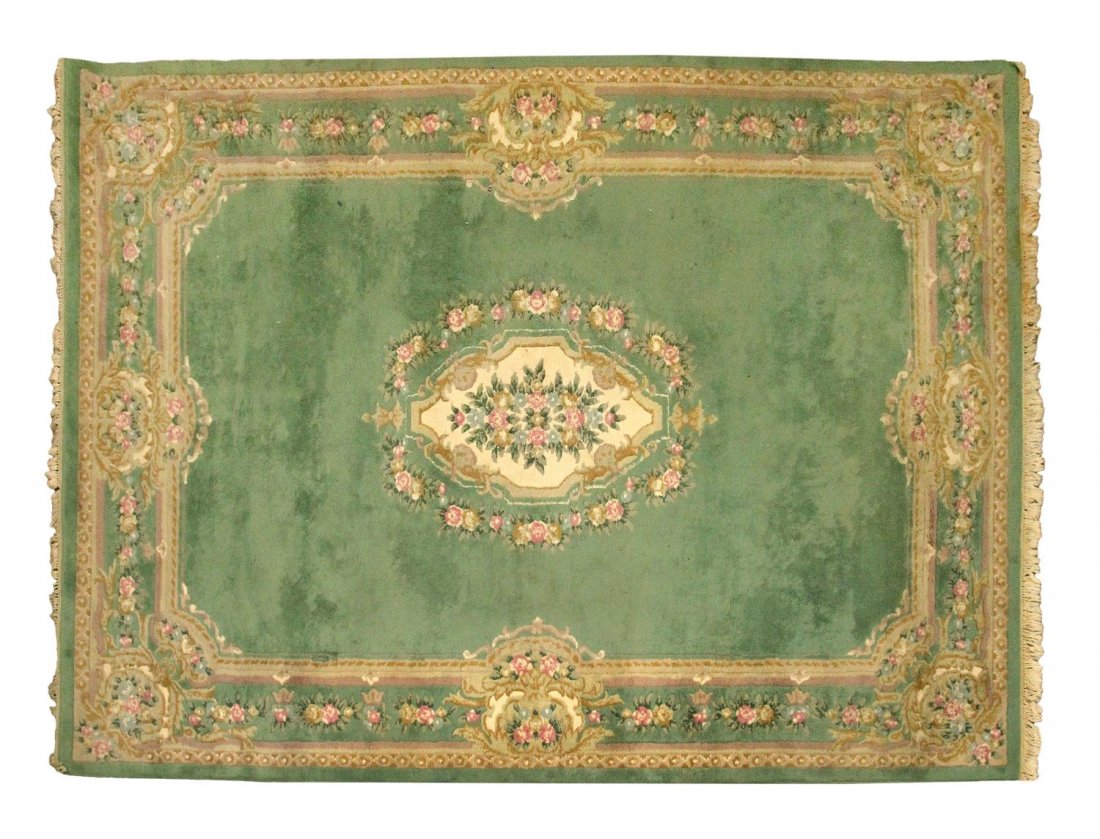 LARGE INDO AUBUSSON WOOL RUG, 9'11 x 14'1": Large Indo Aubusson wool rug, fringe stained at one end, approx: 9'11" x 14'1" Start Price: $200.00
