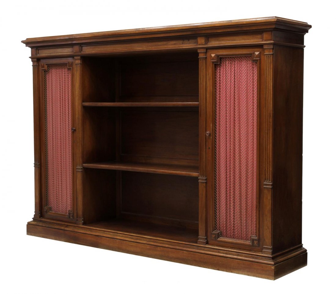 FRENCH RENAISSANCE REVIVAL BOOKCASE: French Renaissance Revival walnut bookcase, c. 1900, ex. Hotel Aiglon, Menton, France, a protruding cornice over the open center with shelves flanked at each side by a screen front door opening to she