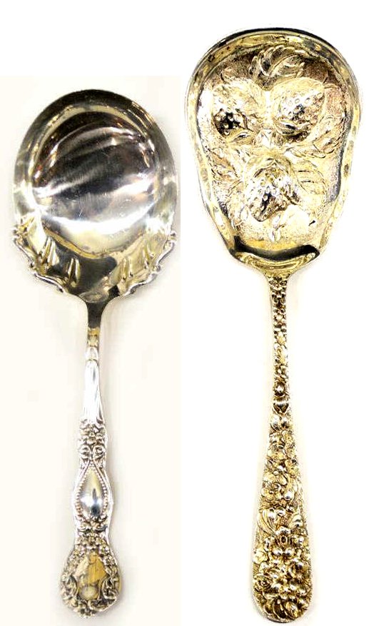 (2) STEIFF ROSE & STERLING SILVER SERVICE SPOONS: (lot of 2) Sterling silver spoons: (1) Steiff 'Rose' repousse sterling berry spoon, the stem completely covered in flowers, the shaped bowl textured and detailed with strawberries in relief, 8"l; (1) 