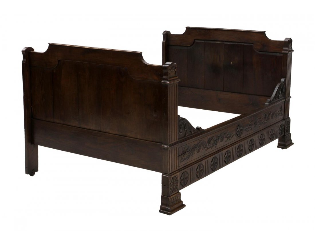 FRENCH OAK ALCOVE BED, 19TH C.: French oak alcove bed, 19th c., the shaped foot and headboards joined by the foliate carved front rail and plain back rail, front rail: 20.5"h, 69"l, headboard and footboard 41.75"h, 52.5"w, inside: 6
