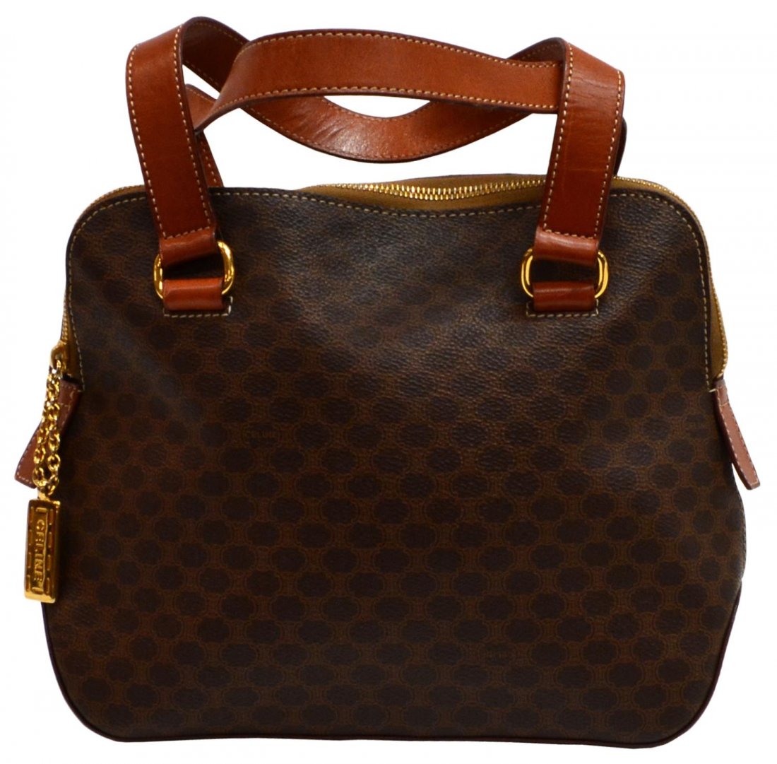 CELINE BROWN MACADAM MONOGRAM HANDBAG: Celine handbag in brown macadam monogram canvas, brown handles and trim, gold tone hardware, zipper opening to brown lined interior with single zip pocket and large cell pocket, few ink / pen stains t