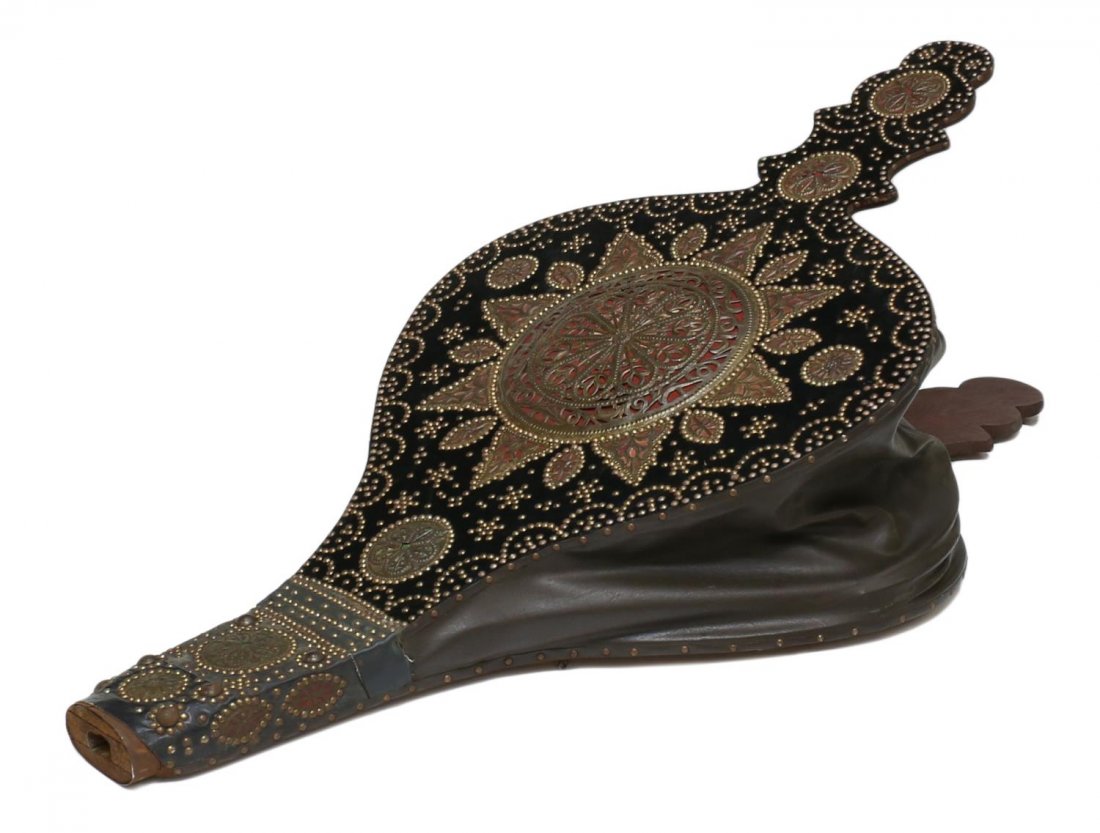 ELABORATELY DECORATED CONTINENTAL BELLOWS: Large bellows, Continental, 20th c., wood and leather, one side with elaborate decoration including circular pierced brass, many patterned nail heads, on end: 59"h, 30"w, 8.5"d Start Price: $80.00