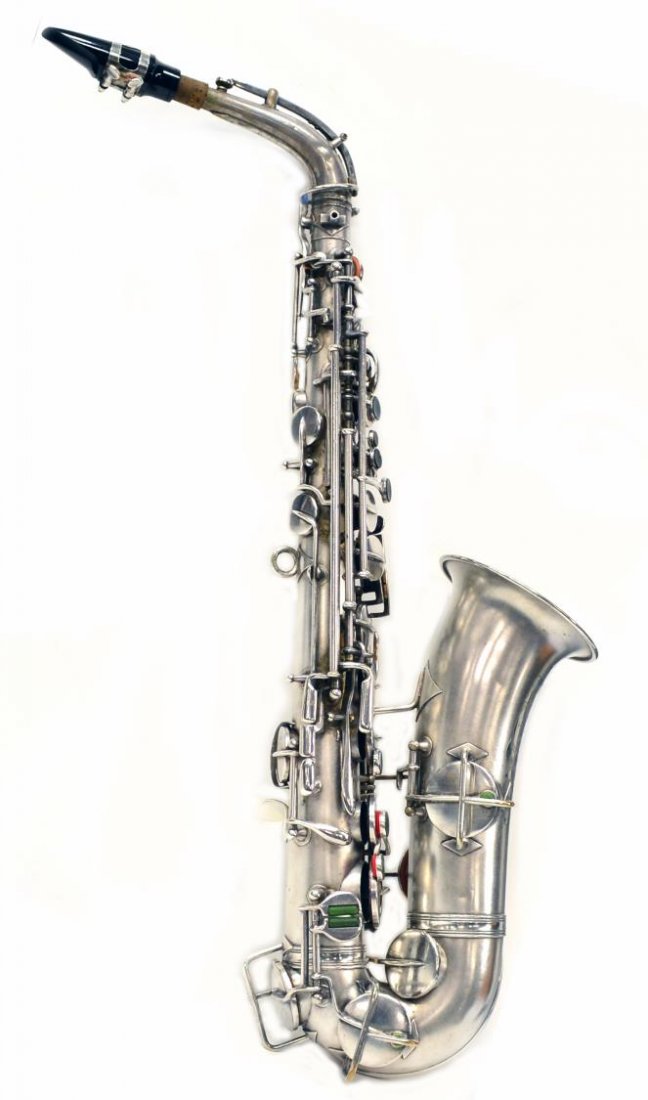 CASED FRANK HOLTON COMPANY SILVERPLATE SAXOPHONE: American silver plate saxophone, c. 1914- 1915, foliated reserve engraved with maker, Frank Holton Company, Elkhorn, Wisconsin, presented in a lined carrying case, some small dents to body, instrument