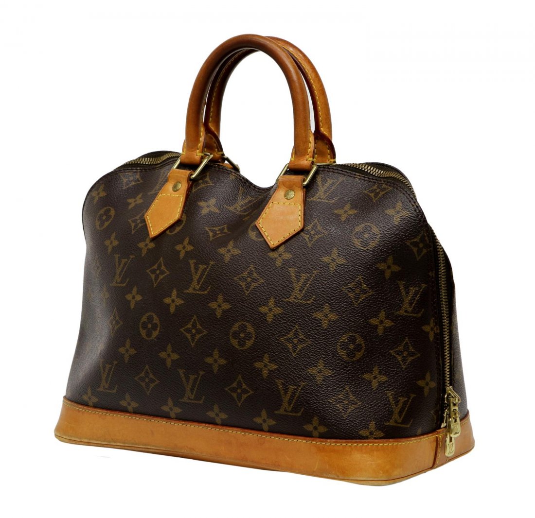 LOUIS VUITTON MONOGRAM CANVAS ALMA HANDBAG: Louis Vuitton "Alma" monogram canvas handbag, leather handles and trim, gold tone hardware, the dual zip opening to a canvas lined interior with slip pocket, accompanied by new key and zipper lock, sc